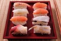 Sushi various selection prawn salmon red plate chopsticks close up Royalty Free Stock Photo