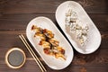 Sushi on white plate on wooden background with copy space. Japanese food. teriyaki sauce on sushi Royalty Free Stock Photo