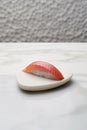 Sushi on a white triangular plate