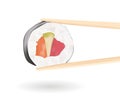 Sushi. Wooden chopsticks holding a roll