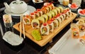Sushi on wooden stand on table in Chinese restaurant Royalty Free Stock Photo