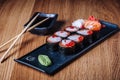 Sushi on a Wooden Table in Restaurant, Delicious Japanese Food, Sushi Rolls Royalty Free Stock Photo