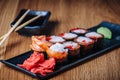 Sushi on a Wooden Table in Restaurant, Delicious Japanese Food, Sushi Rolls Royalty Free Stock Photo