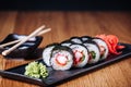 Sushi on a Wooden Table in Restaurant, Delicious Japanese Food, Sushi Rolls Royalty Free Stock Photo