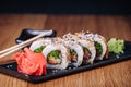 Sushi on a Wooden Table in Restaurant, Delicious Japanese Food, Sushi Rolls Royalty Free Stock Photo