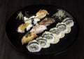 Sushi zuko maki with shrimp, cheese, cucumber and black masago caviar. Homemade dragon roll, japanese food. Royalty Free Stock Photo