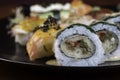 Sushi zuko maki with shrimp, cheese, cucumber and black masago caviar. Homemade dragon roll, japanese food. Royalty Free Stock Photo