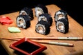 Sushi zuko maki with shrimp, cheese, cucumber and black masago caviar. Royalty Free Stock Photo