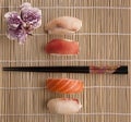 Sushis and chopsticks on a bamboo mat Royalty Free Stock Photo