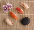 Sushis and chopsticks on a bamboo mat Royalty Free Stock Photo