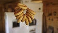 Sushki bread rings hanging in traditional rustic kitchen Royalty Free Stock Photo