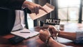 Suspect with handcuffs being interviewed in interrogation room by Police officer, Criminal law concept Royalty Free Stock Photo