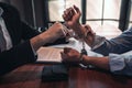 Suspect with handcuffs being interviewed in interrogation room by Police officer, Criminal law concept Royalty Free Stock Photo