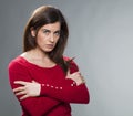 Suspecting 30s woman standing with arms crossed Royalty Free Stock Photo