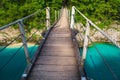 Suspended bridge above the emerald color Isonzo river, Kobarid Slovenia