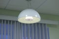 suspended ceiling lamp in vintage style with a light shade