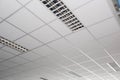 Suspended ceiling with LED square lamps sin the office Royalty Free Stock Photo