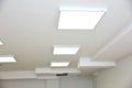 Suspended ceiling with modern LED lighting.