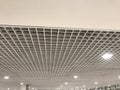 Suspended false ceiling design architectural with macro grid sizes in small for an large space commercial building interior