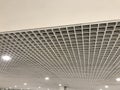 Suspended false ceiling design architectural with macro grid sizes in small for an large space commercial building interior