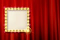 Suspended gold frame on the red curtain Royalty Free Stock Photo