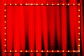 Suspended gold frame on the red curtain background Royalty Free Stock Photo