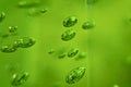 Suspended green air bubbles macro
