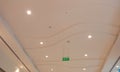 Suspended Gypsum false ceiling and coves are white painted and installed for an commercial shopping mall interiors and Industry