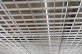 Suspended modern ceiling in the office. Loft style office ceiling design