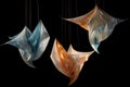 suspended origami shapes in a gentle dance