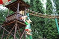 Suspended roman afraid with an gauls above dolls from Epidemais Croisiere attraction at Park Asterix, Ile de France, France