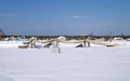 Suspended wooden bridge over the Voloshka River, Russia. Clear winter day Royalty Free Stock Photo