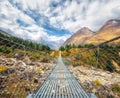 Suspension bridge and beautiful himalayan mountains