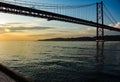 Suspension bridge in the city of Lisbon. Huge metal structure Royalty Free Stock Photo