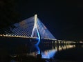 Suspension bridge colorfully lighted up at night in the city Royalty Free Stock Photo