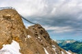 Suspension bridge connecting two mountain peaks at an altitude of 3000 meters.