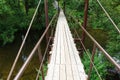 Suspension bridge, Crossing the river, ferriage in the woods Royalty Free Stock Photo