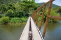 Suspension bridge, Crossing the river, ferriage in the woods Royalty Free Stock Photo