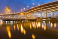 Suspension bridge and highway curved riverside Royalty Free Stock Photo