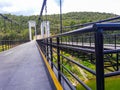 The suspension bridge is made of white steel