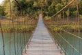 Suspension bridge made of wood and sling.