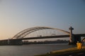 The suspension bridge named van Brienenoordbrug and offices in the morning sun in Rotterdam