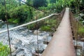 Suspension bridge over Caldera river near Boquete Panama , on Lost Waterfalls hiking trai Royalty Free Stock Photo