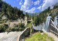 suspension bridge over dam in the Austrian mountains Royalty Free Stock Photo