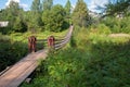 Suspension bridge over the river Belaya in the village of Lyubytino