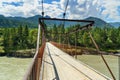 Suspension bridge over river Katun. Altai Republic, Russia Royalty Free Stock Photo