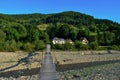 Suspension bridge over the river in mountains Carpathians, Romania