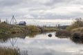 Suspension bridge over the river in the village Royalty Free Stock Photo