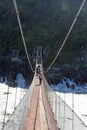 Suspension Bridge over Storms River in rough weather in Tsitsikamma National Park, Garden Route, nr Knysna, South Africa. Royalty Free Stock Photo