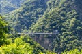 Suspension bridge over stream flowing between gorge in Taroko National Park in Hualien of Taiwan Royalty Free Stock Photo